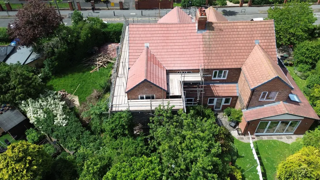 Reduce energy bills: aerial view of a new tiled roof fitted by Legge Roofing